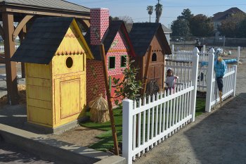 Recognize this set of homes? A trio of pigs inhabit these structures. This is one of many fairy-tale settings in the Children's Storybook Garden & Museum.